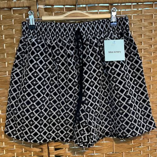PANTALON CORTO NEGRO ESTAMPADO